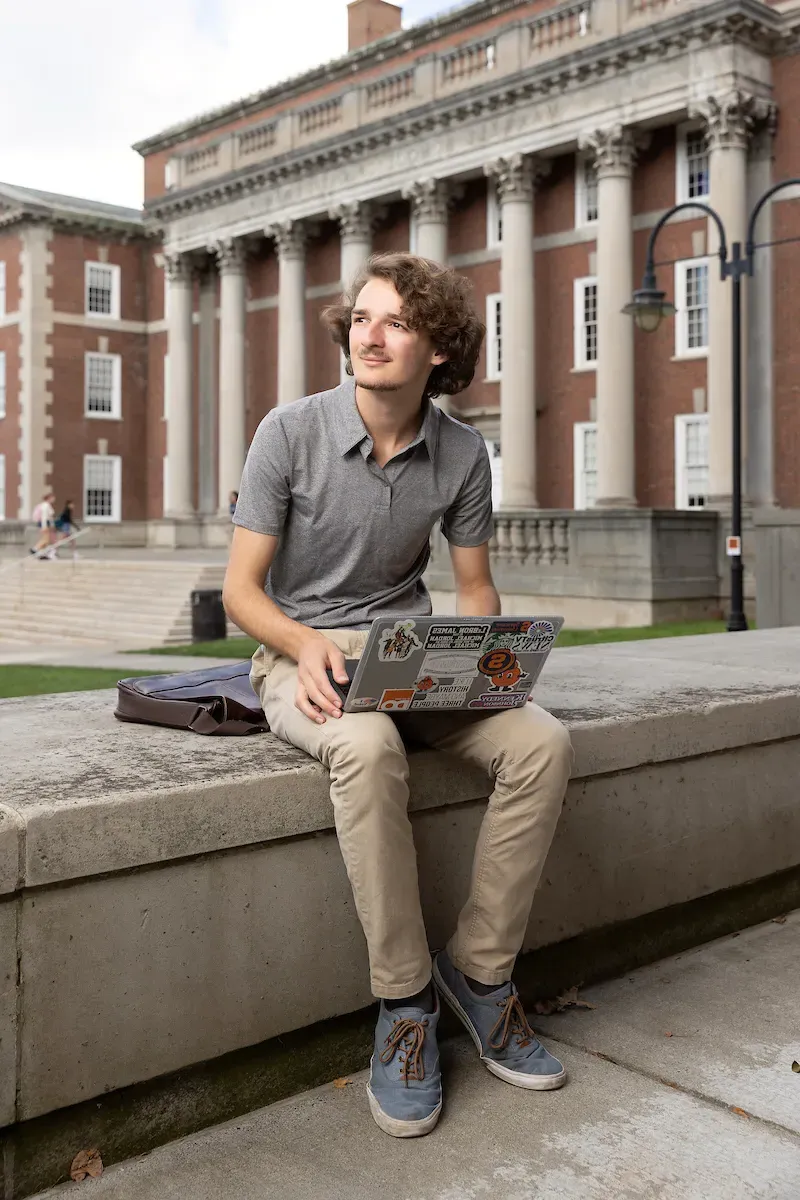 Dominic Chiappone sitting outside the Maxwell building.